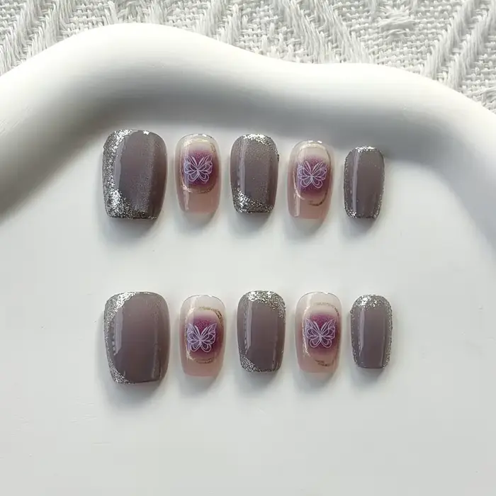 Femmes à la main papillon violet avec diamants conceptions scintillant oeil de chat presse sur les ongles pièce d'ongle