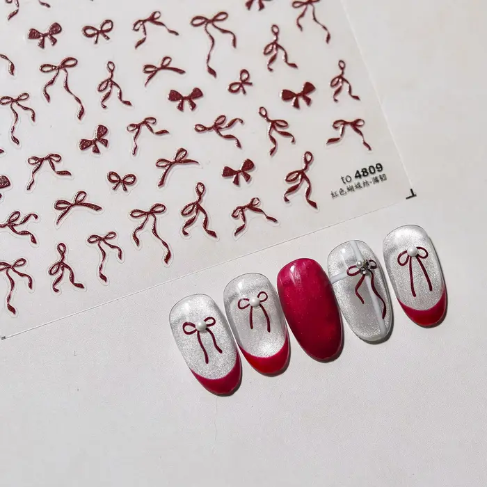 Autocollants pour ongles avec nœud en ruban rouge