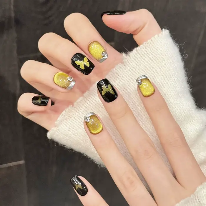 10 faux ongles faits à la main avec motif papillon doré et effet œil de chat noir, à presser, pour m
