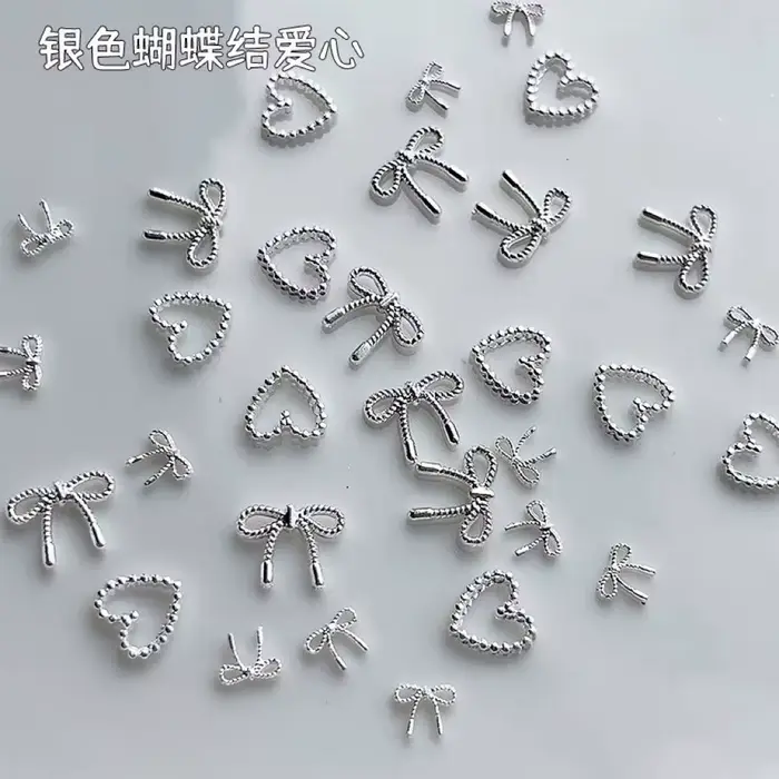 Décorations d'ongles avec nœud papillon en argent