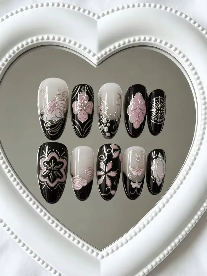 10 faux ongles en forme d'amande de longueur moyenne, coloris noir et nude avec motifs floraux roses