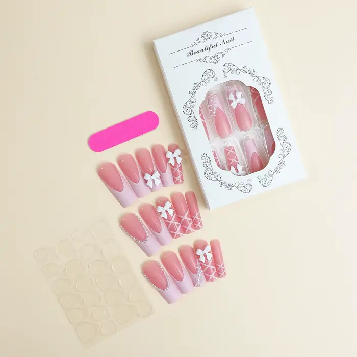 Faux ongles décoratifs avec nœud blanc