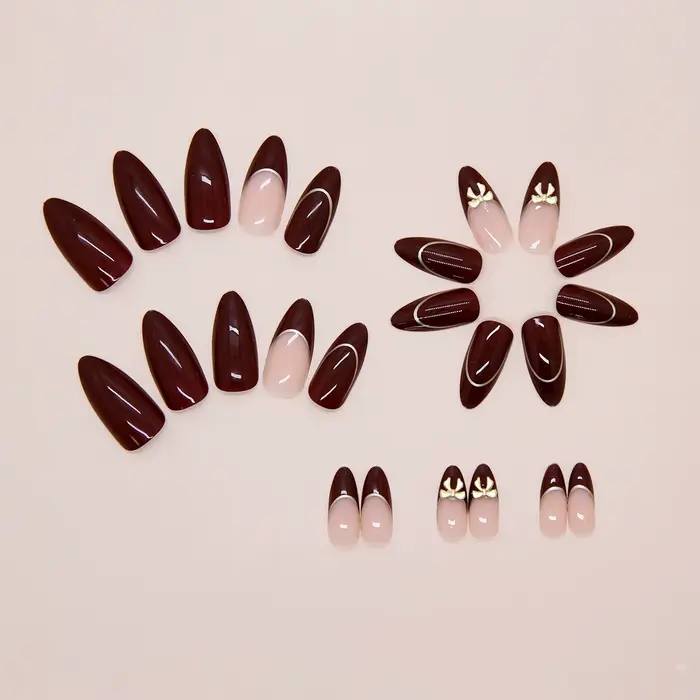 24 ongles d'amande faits à la main. Base bordeaux avec détails français nude