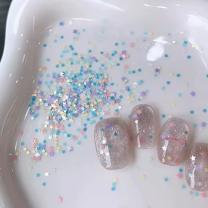 1 boîte de paillettes pour ongles en forme d'étoile